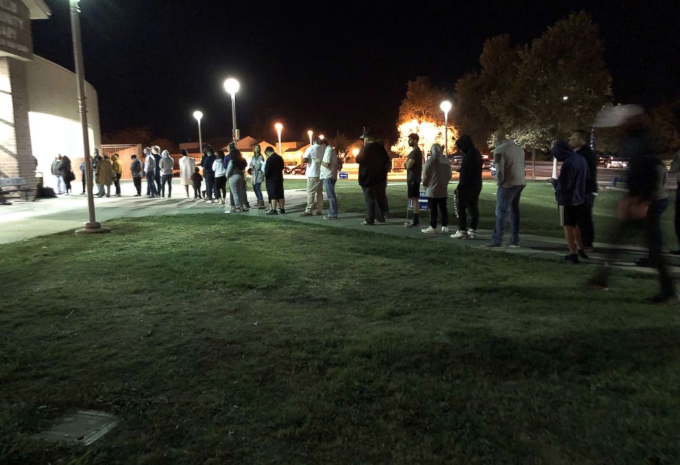 PHOTO: Vishal Kaura was in good company still waiting on line in the cold to vote Tuesday night in Elk Grove, Calif., Nov. 6, 2018.