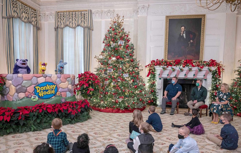 PHOTO:First Lady Jill Biden , Martin (2R) and Chris Kratt from the television show,Wild Kratts and students from Malcolm Elementary School in Waldorf, Maryland, watch a puppet show during an event at the White House, Nov. 29, 2021.