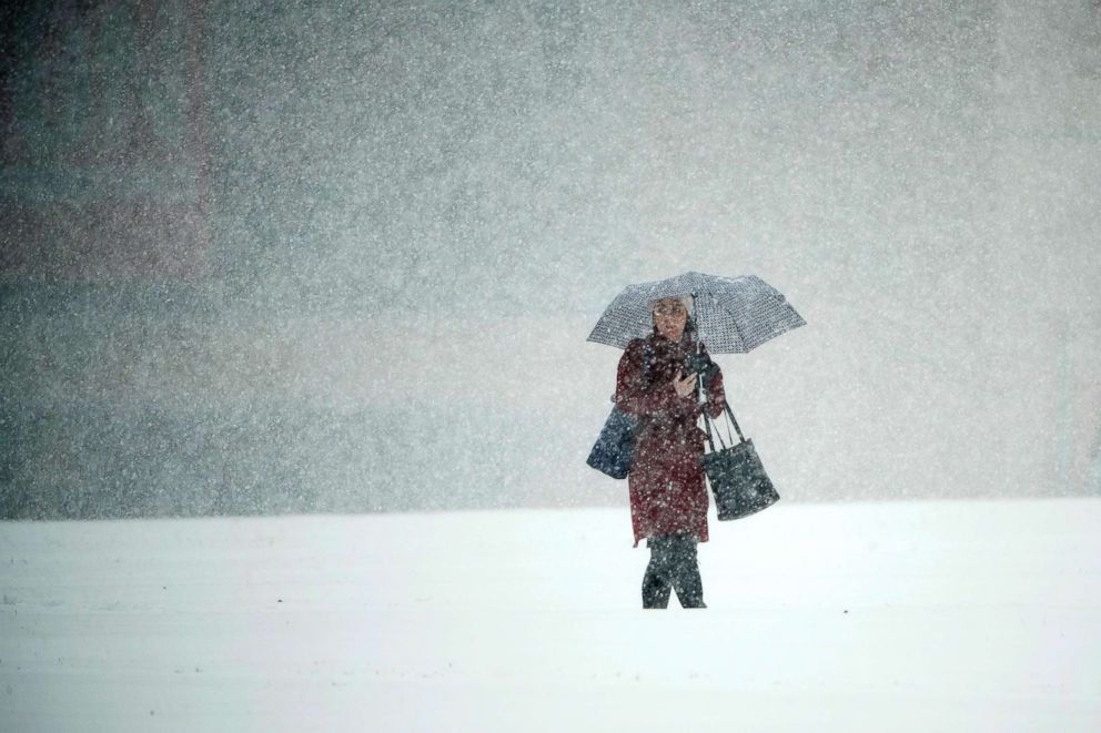 PHOTO: A person walks across Independence Mall during a snow storm in Philadelphia, Nov. 15, 2018.