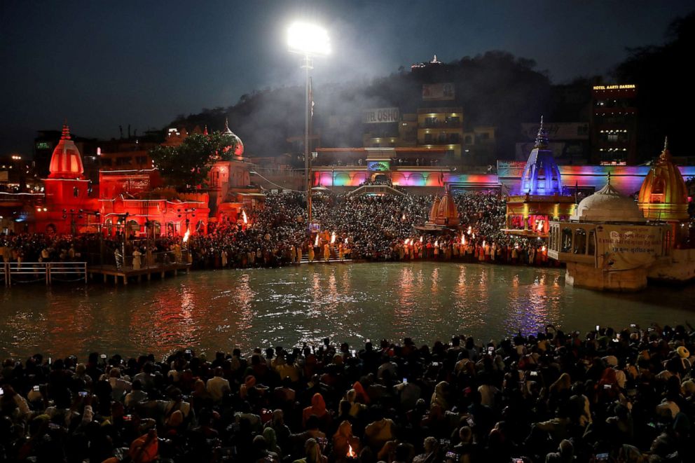 PHOTO: Devotees gather for evening prayer on the banks of the Ganges river during Kumbh Mela (the Pitcher Festival) in Haridwar, India, April 13, 2021.