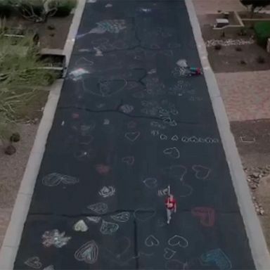 VIDEO: Residents cover streets of quiet Mesa neighborhood with chalk hearts to spread cheer during outbreak