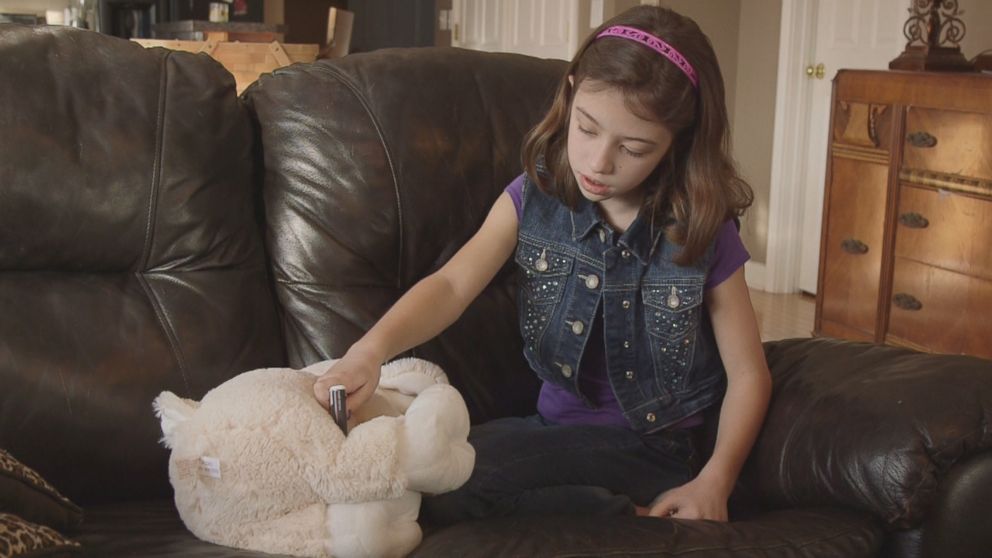 PHOTO: Audrey Stepp injects her toy named Lamb with Naloxone.