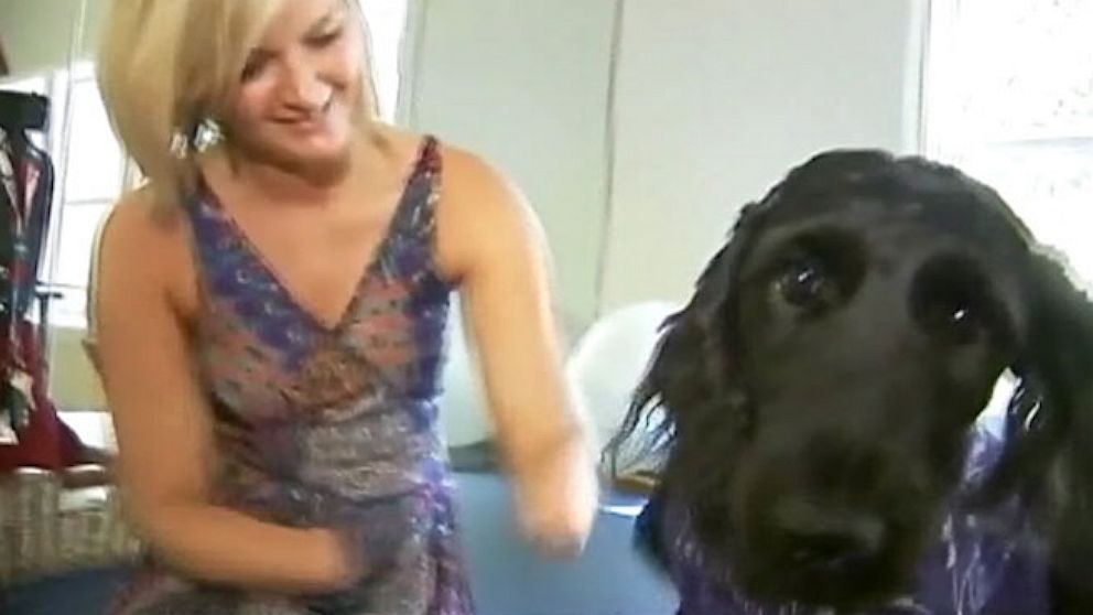 Amputee Aimee Copeland with her new service dog named Belle. 