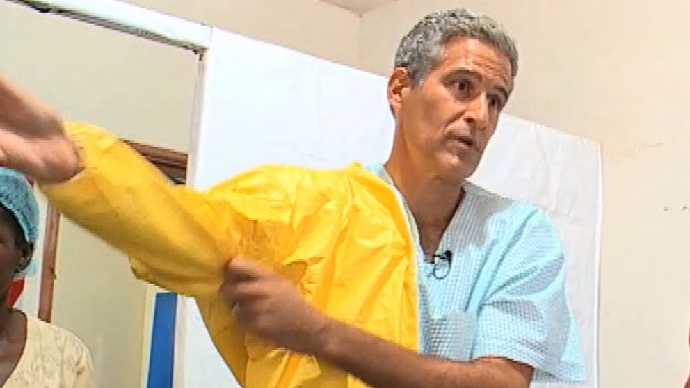PHOTO: Dr. Richard Besser must wear multiple layers of protective gear before entering an Ebola Ward. 