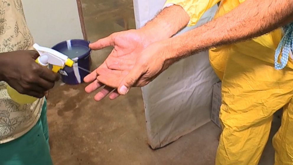 PHOTO: Dr. Richard Besser must wear multiple layers of protective gear before entering an Ebola Ward. 