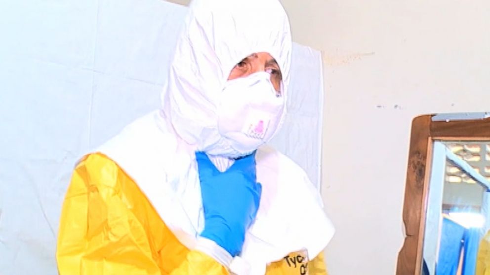 PHOTO: Health care workers wear multiple layers to ensure they are not exposed to Ebola in the ward. 