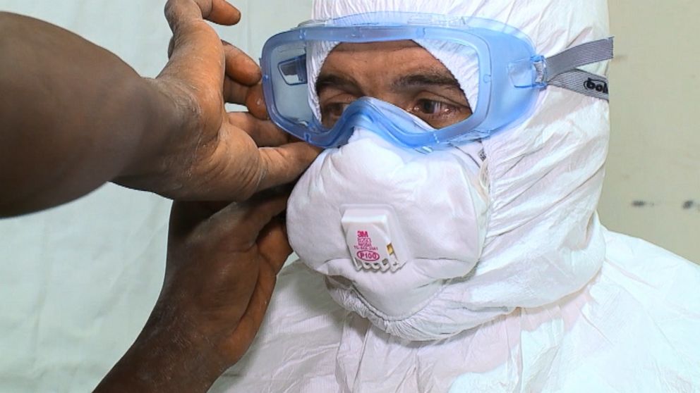 PHOTO: Dr. Richard Besser must wear multiple layers of protective gear before entering an Ebola Ward. 