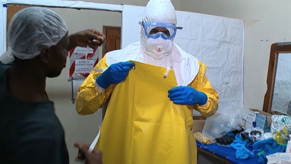 PHOTO: Health care workers wear multiple layers to ensure they are not exposed to Ebola in the ward. 