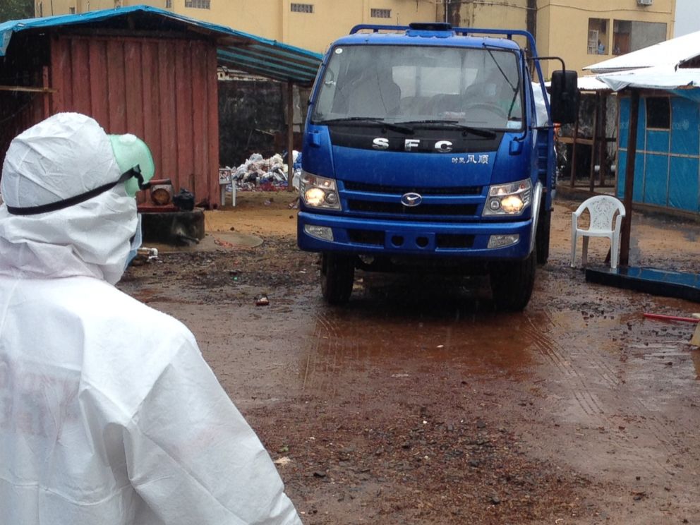 PHOTO: A truck comes to collect bodies from a makeshift Ebola ward in Monrovia, Liberia.