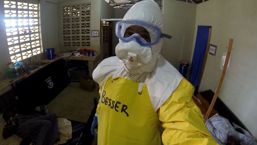 Dr. Richard Besser looks out from behind the many layers of protective gear needed to enter the Ebola ward.