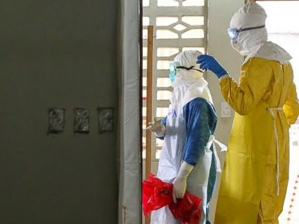 PHOTO: Dr. Besser stands with another doctor at the ELWA Ebola Isolation Unit in Monrovia, Liberia.
