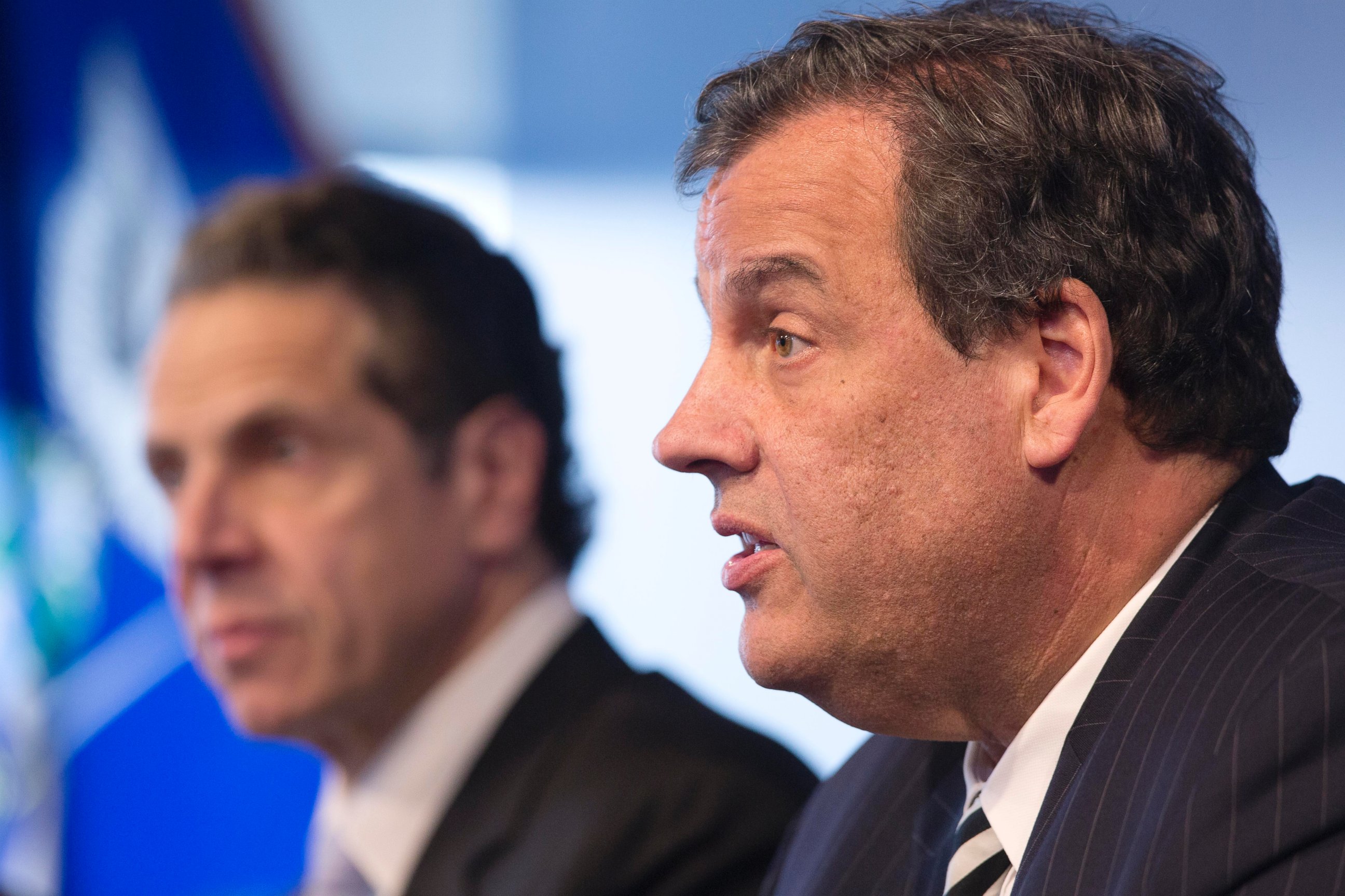 New York Governor Andrew Cuomo, left, listens as New Jersey Governor Chris Christie talks at a news conference, Oct. 24, 2014 in New York.