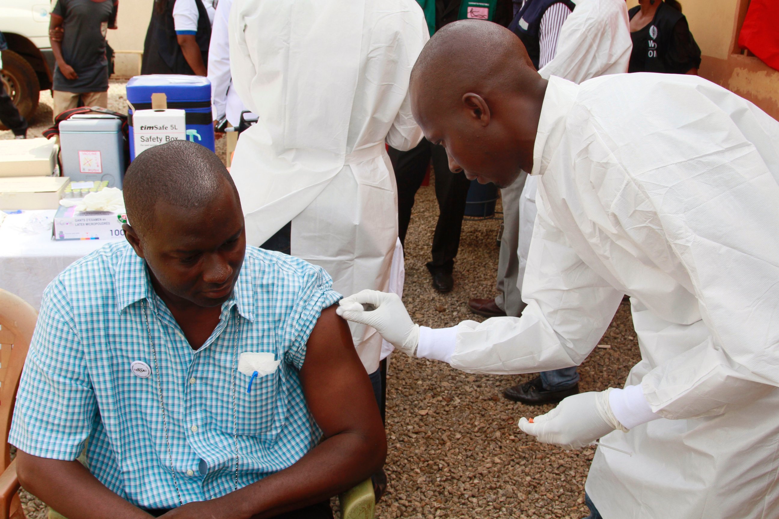 PHOTO:A health worker, right, cleans a man's arm before injecting him with a Ebola vaccine  in Conakry, Guinea in this March 7, 2015 file photo.