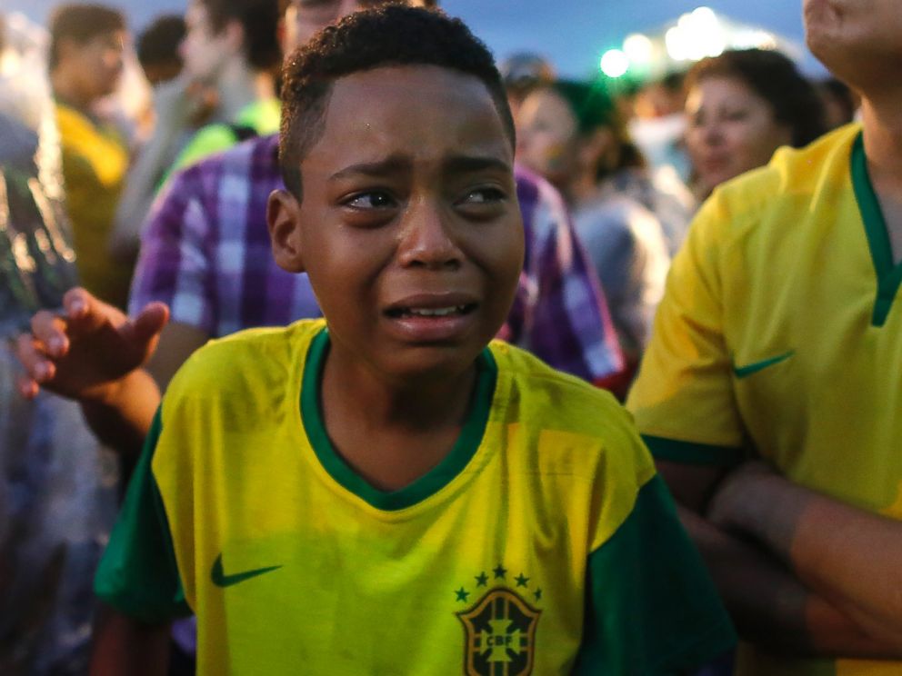 PHOTO: Brazil soccer fans cry as they watch their team get beat during a live telecast of the semi-finals World Cup soccer match between Brazil and Germany, inside the FIFA Fan Fest area on Copacabana beach in Rio de Janeiro, Brazil on July 8, 2014. 