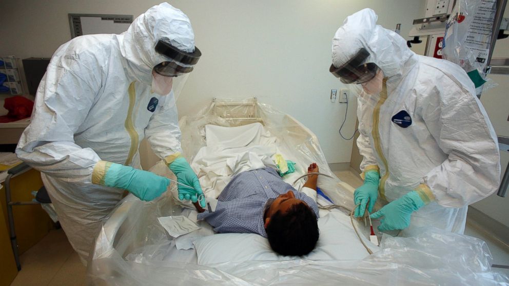 Doctors and staff participate in a preparedness exercise on diagnosing and treating patients with Ebola virus symptoms, at the Ronald Reagan UCLA Medical Center in Los Angeles, Calif.
