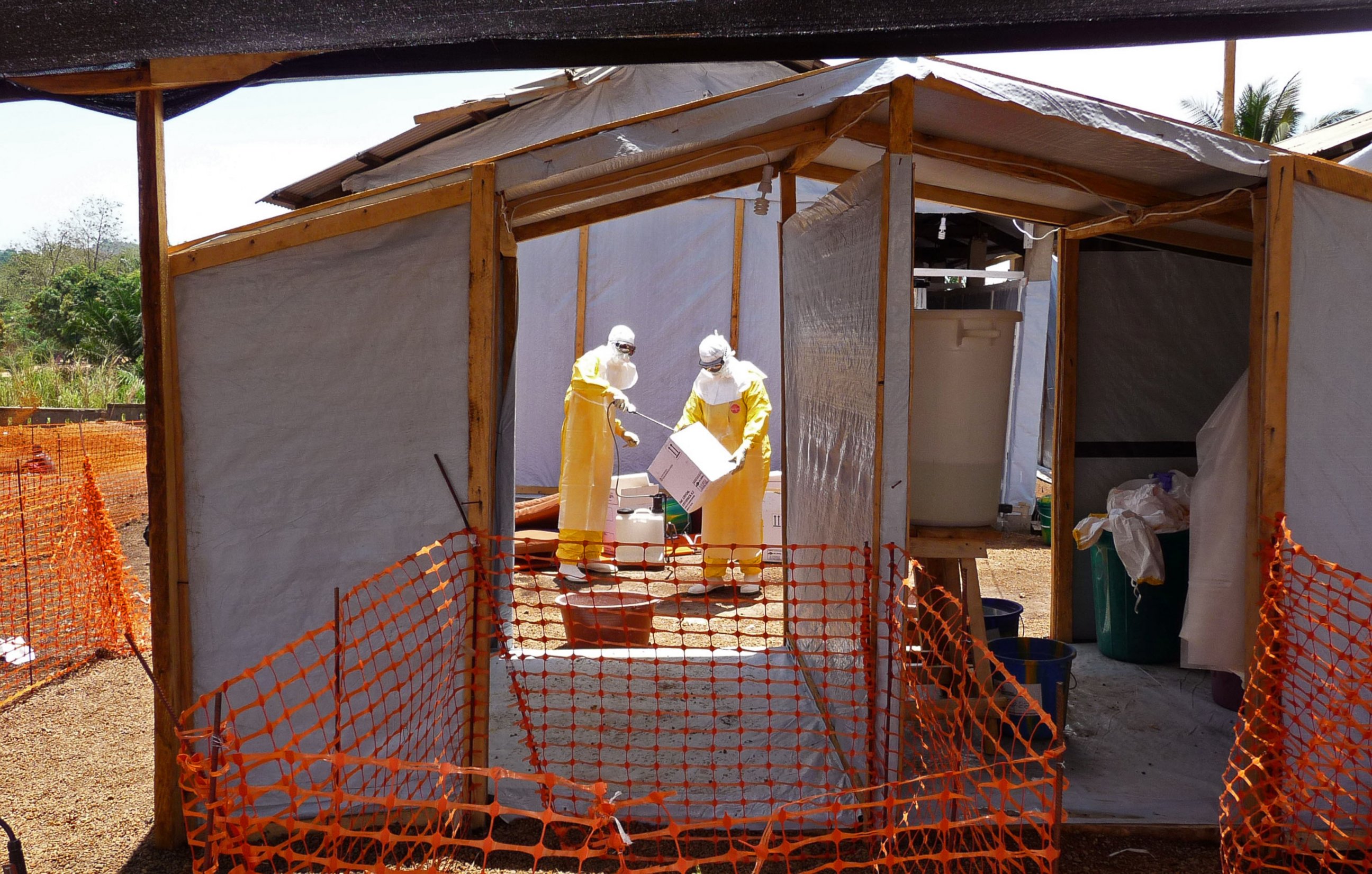 PHOTO: In this photo provide by MSF,  Medecins Sans Frontieres,  taken March 28, 2014, healthcare workers from the organisation prepare isolation and treatment areas for their Ebola, hemorrhagic fever operations, in Gueckedou, Guinea.