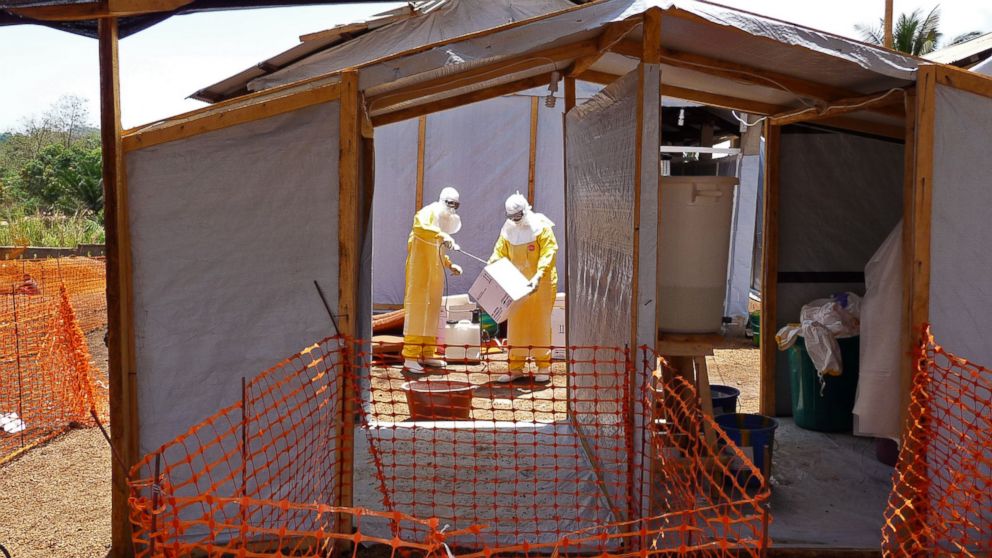 PHOTO: In this photo provide by MSF,  Medecins Sans Frontieres,  taken March 28, 2014, healthcare workers from the organisation prepare isolation and treatment areas for their Ebola, hemorrhagic fever operations, in Gueckedou, Guinea.