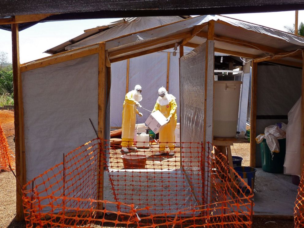 PHOTO: In this photo provide by MSF, Medecins Sans Frontieres, taken March 28, 2014, healthcare workers from the organisation prepare isolation and treatment areas for their Ebola, hemorrhagic fever operations, in Gueckedou, Guinea.