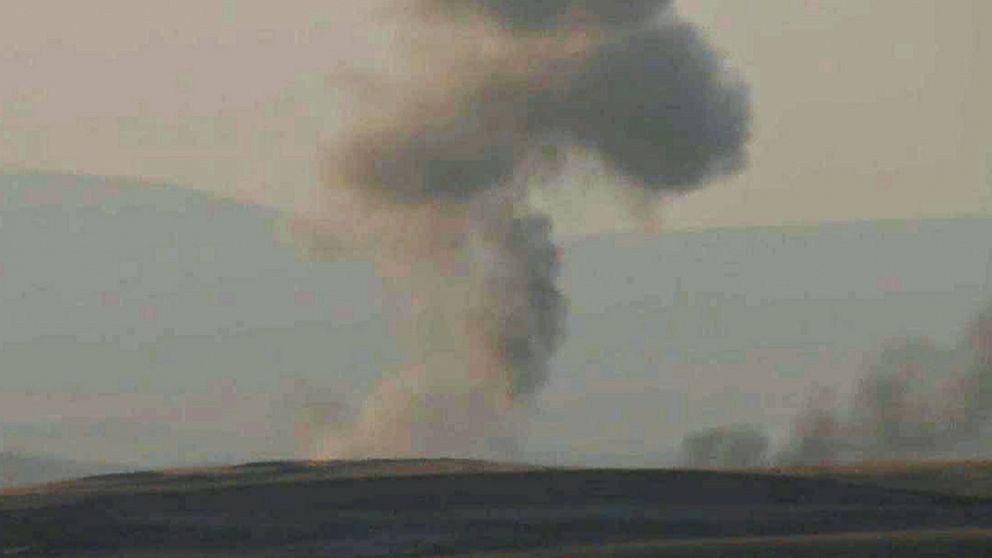 PHOTO: This image made from AP video shows smoke rising from airstrikes targeting Islamic State militants near the Khazer checkpoint outside of the city of Erbil in northern Iraq, Aug. 8, 2014.