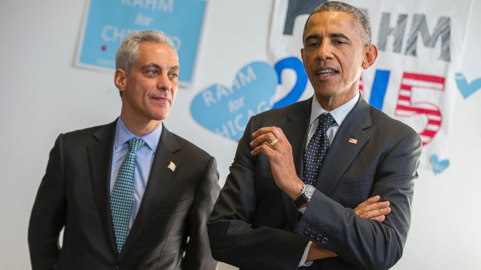 Chicago Mayor Rahm Emanuel listens as President Barack Obama speaks on behalf of Emanuel during a campaign stop in Chicago, Feb. 19, 2015.