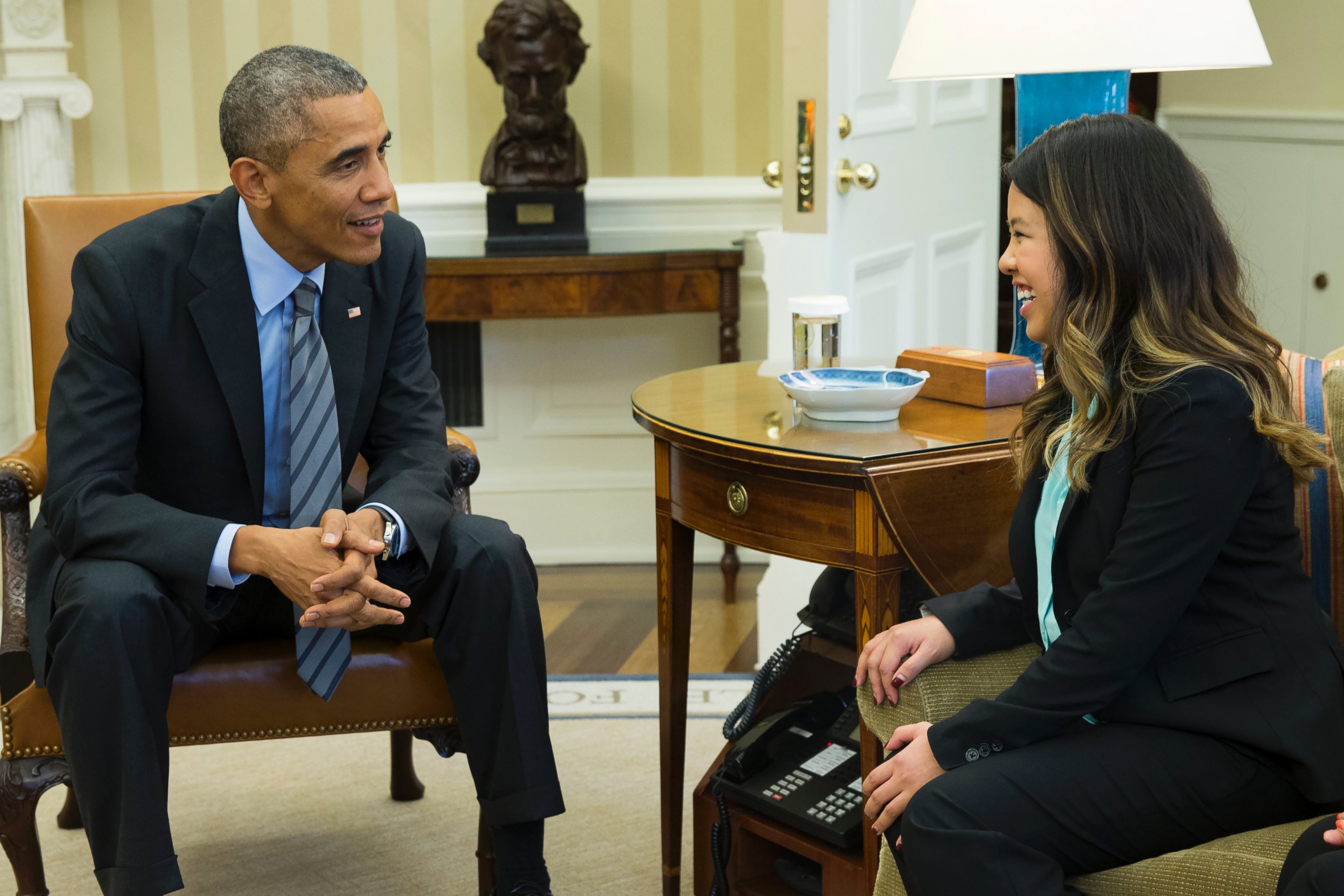 PHOTO: President Barack Obama, left, meets with Ebola survivor Nina Pham, right, in the Oval Office of the White House in Washington, D.C. on Oct. 24, 2014. 