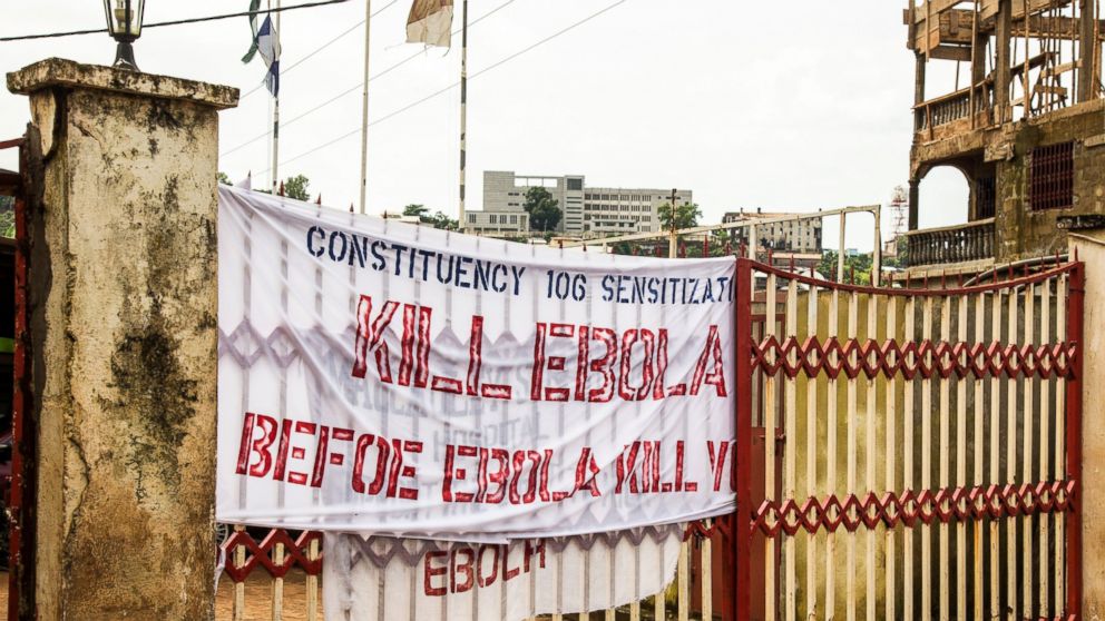 A sign reading 'Kill Ebola Before Ebola Kill You', is seen on a gate forming part of the country's Ebola awareness campaign in the city of  Freetown, Sierra Leone, Sept. 14, 2014. 