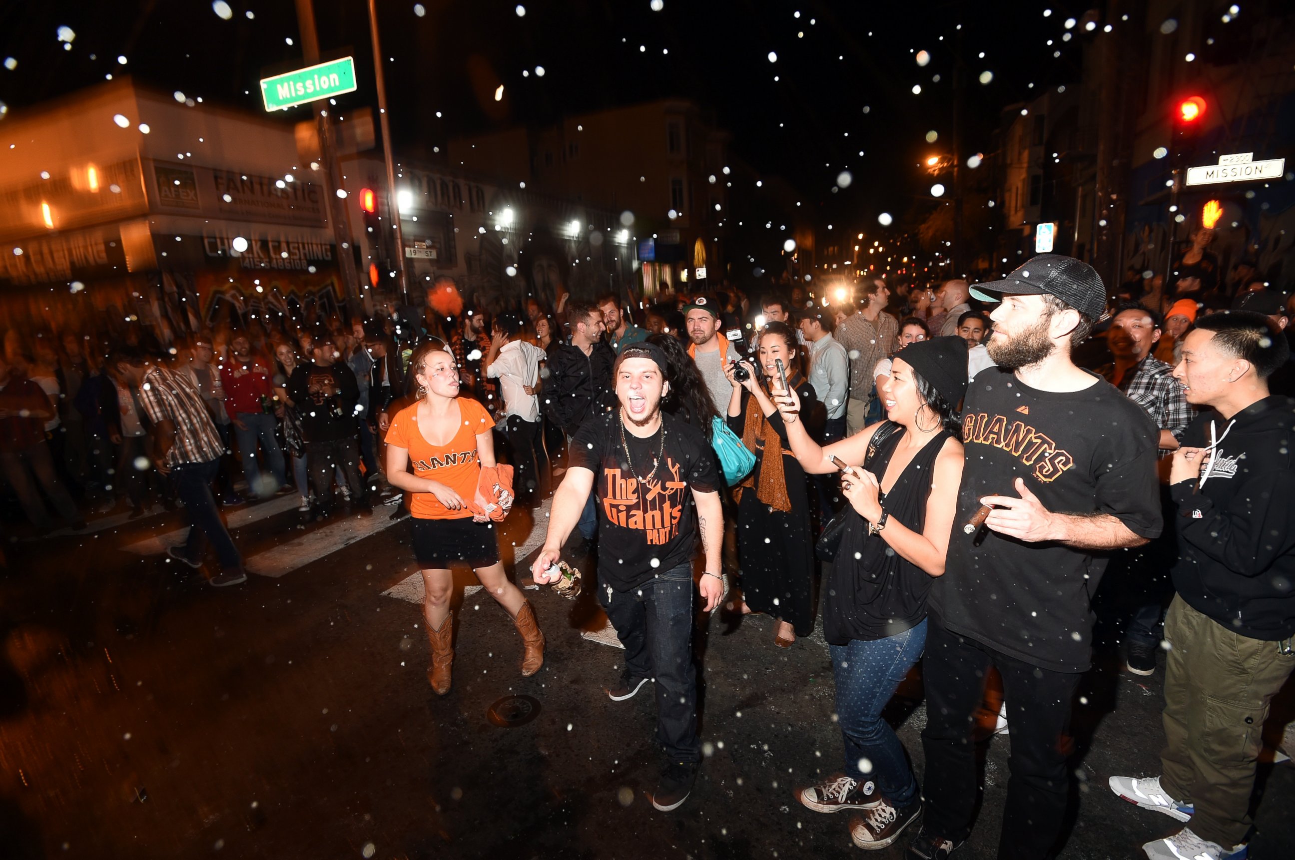 PHOTO: San Francisco Giants fans celebrate in the Mission district after the San Francisco Giants beat the Kansas City Royals to win the World Series on Oct. 29, 2014, in San Francisco. 