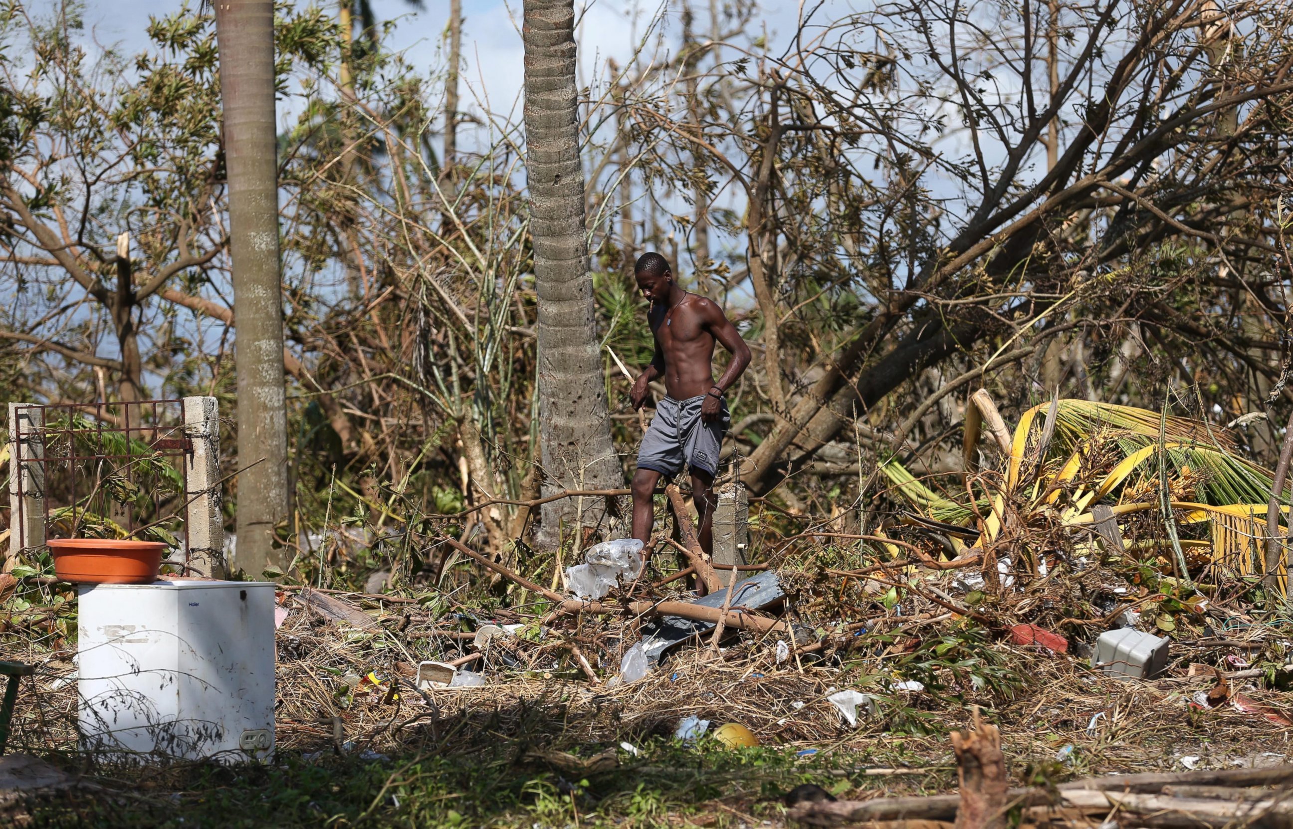 PHOTO: A man walks through the rubble after the passage of Hurricane Matthew in Playa Gelee, Haiti, Oct. 7, 2016. The death toll in Haiti by Hurricane Matthew rose to more than 400, according to South Civil Protection. 