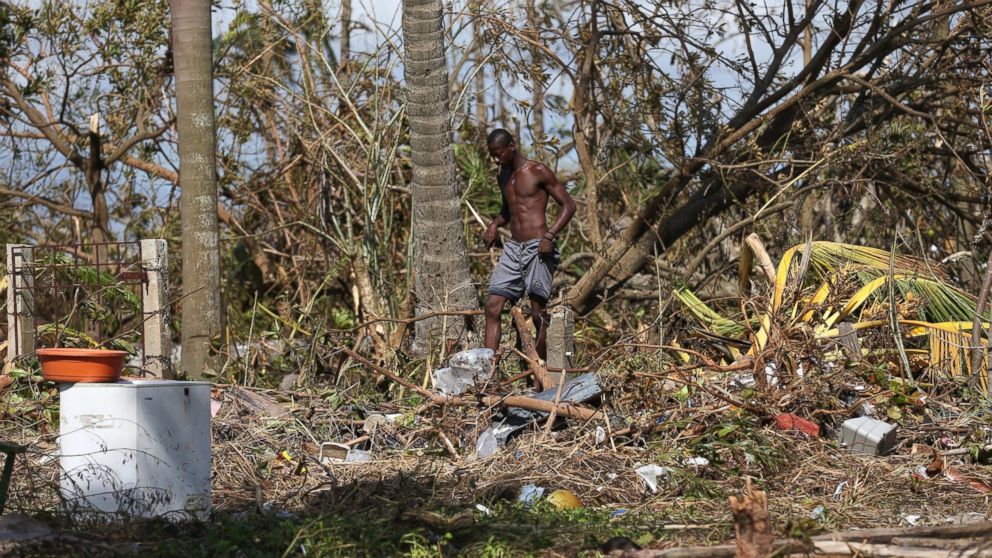 PHOTO: A man walks through the rubble after the passage of Hurricane Matthew in Playa Gelee, Haiti, Oct. 7, 2016. The death toll in Haiti by Hurricane Matthew rose to more than 400, according to South Civil Protection. 