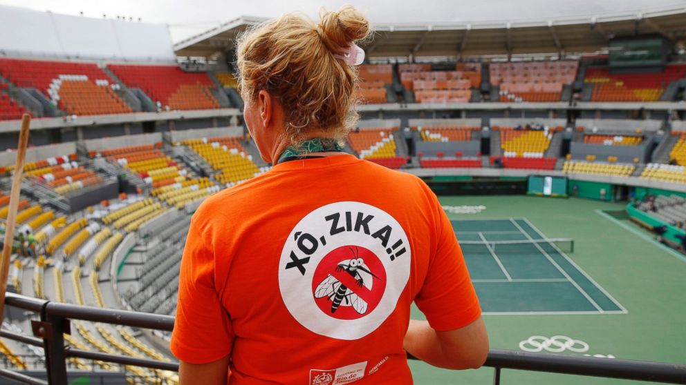 A worker cleaning at the Olympic Tennis Center wears a shirt with an anti-Zika slogan in Rio de Janeiro, Brazil, Aug. 3, 2016. 