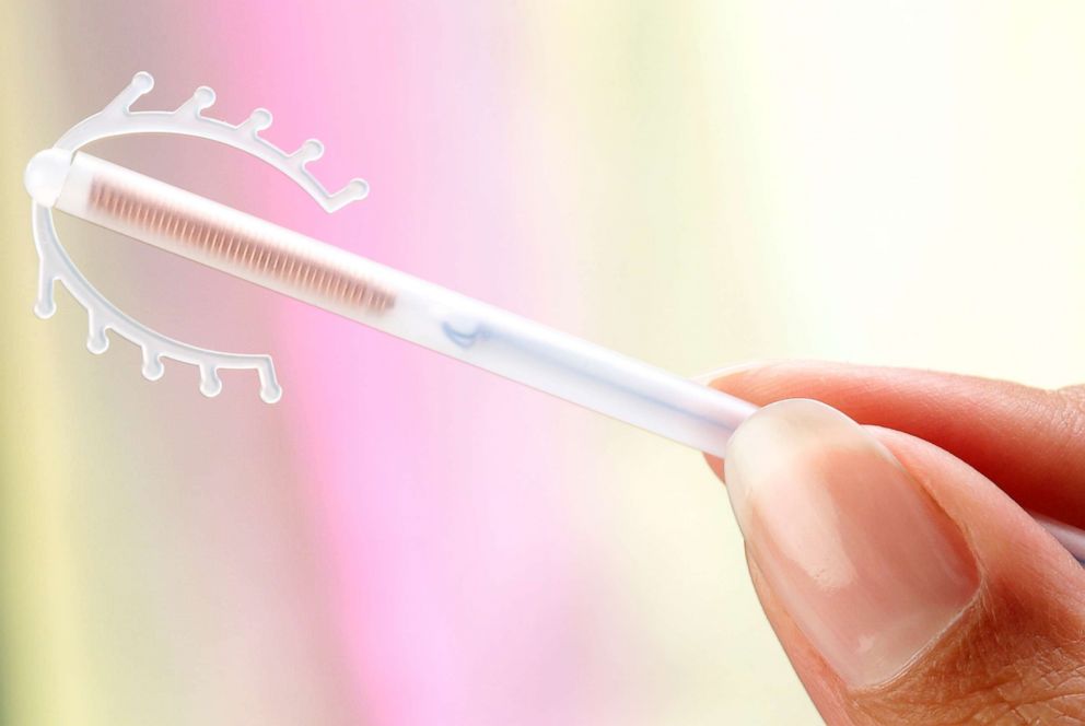 PHOTO: This stock photo depicts a female holding an intrauterine device (IUD).