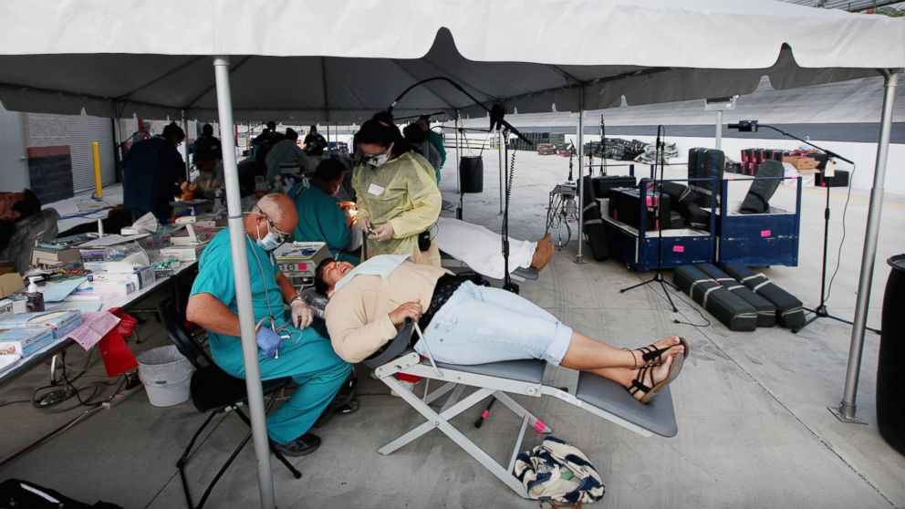 An uninsured patient receives dental care from doctors who volunteer at the Remote Area Medical (RAM) free clinic at the Bristol Motor Speedway, located in the mountains of Appalachia, on April 15, 2012 in Bristol, Tennessee.