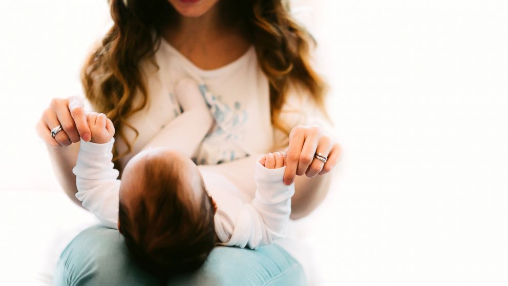 A mother and baby play.
