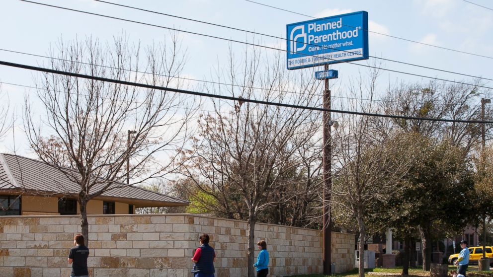Anti-abortion, pro-life activists pray outside a Planned Parenthood clinic, Feb. 22, 2016, in Austin, Texas.