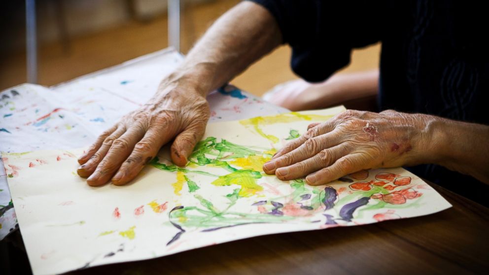 A patient participates in an art therapy class in a retirement home in Rueil Malmaison, France. This retirement home houses people suffering from Alzheimer's disease and related dementia.