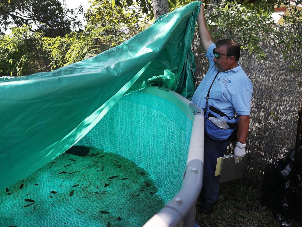 PHOTO: Robert Muxo, a Miami-Dade County mosquito control inspector, inspects a property for mosquitos or breeding areas in the Wynwood neighborhood as the county fights to control the Zika virus outbreak on July 30, 2016 in Miami.