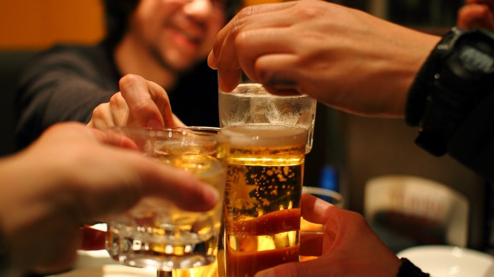 PHOTO: Friends drink whiskey and beer in this stock photo.