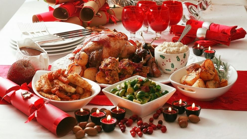 A Christmas dinner complete with roast turkey is displayed.