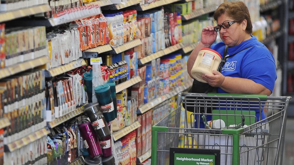 A shopper reads the label on a package of non-dairy creamer at a Walmart Neighborhood Market in Panorama City, Calif., Sept. 28, 2012. 