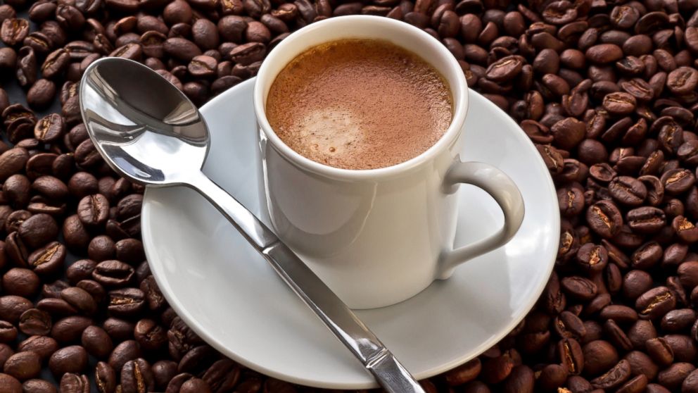 PHOTO: Espresso coffee on coffee beans. 