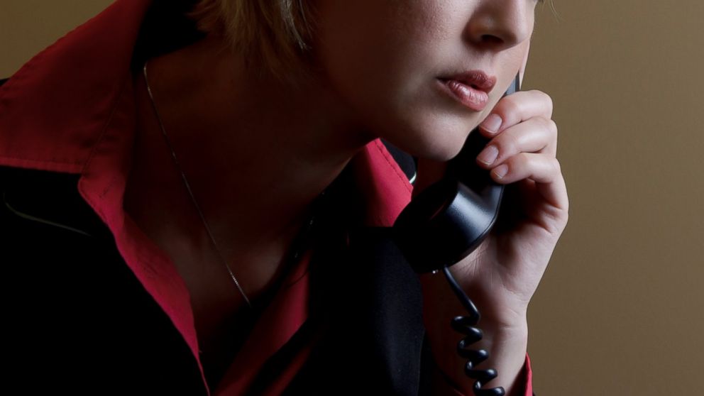 A woman speaks on the phone in this undated file photo.