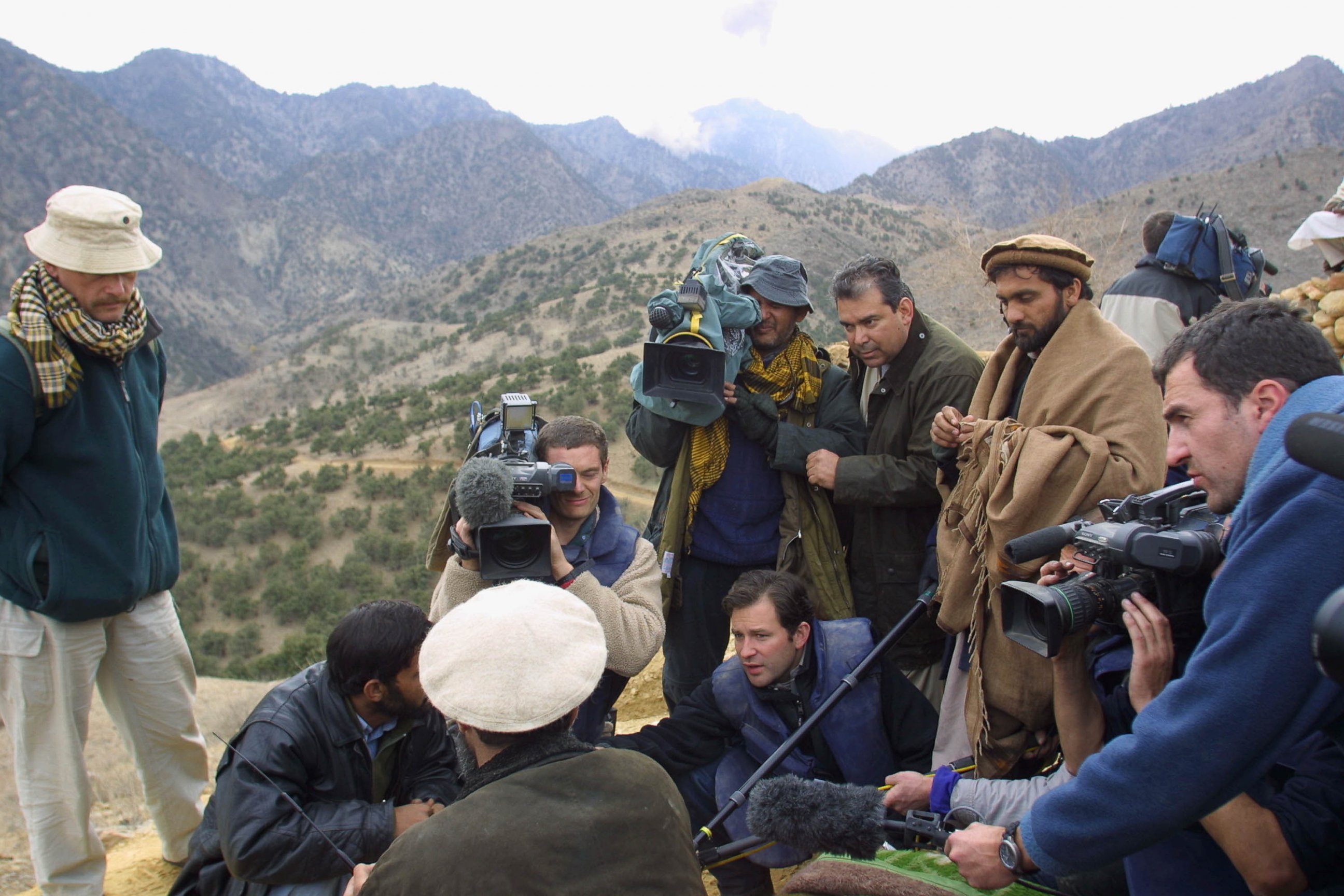 PHOTO: Dan Harris, amongst other journalists, is pictured questioning Hazrat Ali on Dec. 14, 2001 in the Tora Bora region of Afghanistan.