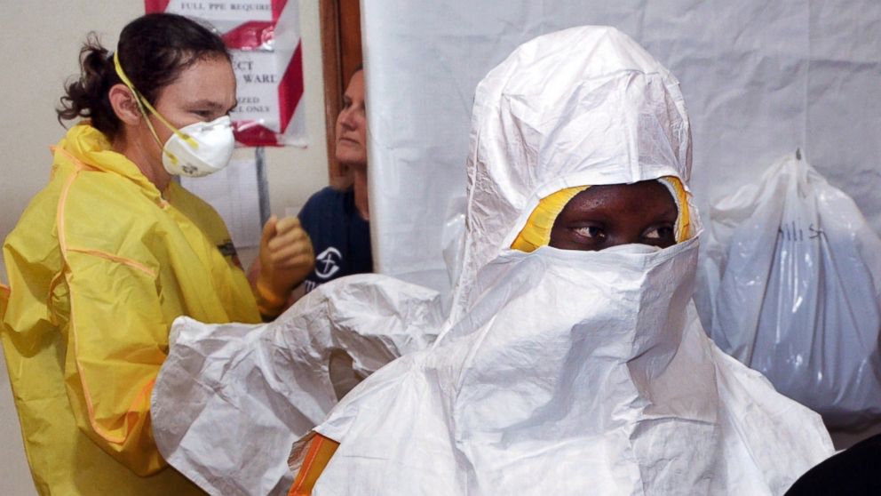 Staff of the Christian charity Samaritan's Purse is pictured putting on protective gear in the ELWA hospital in Monrovia, Liberia on July 24, 2014. 
