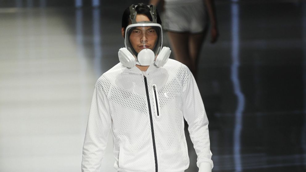 PHOTO: Pollution-blocking masks became the latest fashion statement on the runway at Fashion Week in Beijing, Oct. 28, 2014.