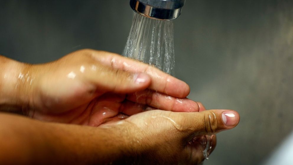 A nurse washes his hands in this undated file photo.