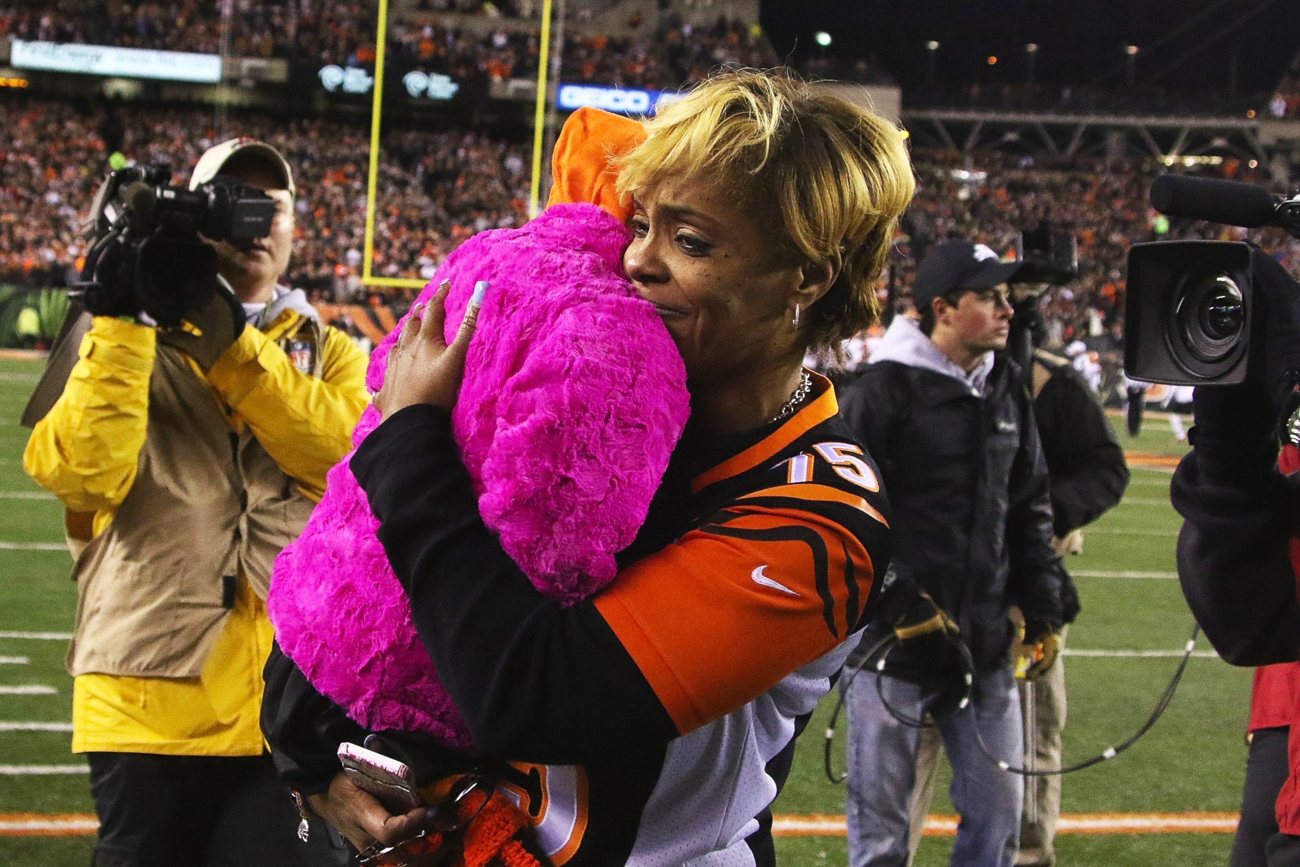 PHOTO: Leah Still, daughter of Devon Still #75 of the Cincinnati Bengals, is carried off of the field by her grandmother