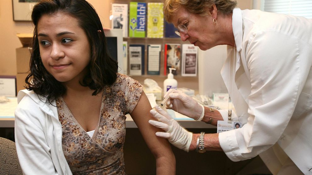 University of Iowa junior Erica Zamudil receives a mumps, measles and rubella vaccination shot at the school's Student Health Service in Iowa City, Iowa. 