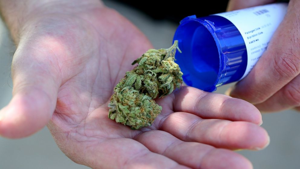 PHOTO:Chuck Grant displays his medical marijuana that he picked up from Massachusetts first medical marijuana dispensary in Salem, June 24, 2015.  