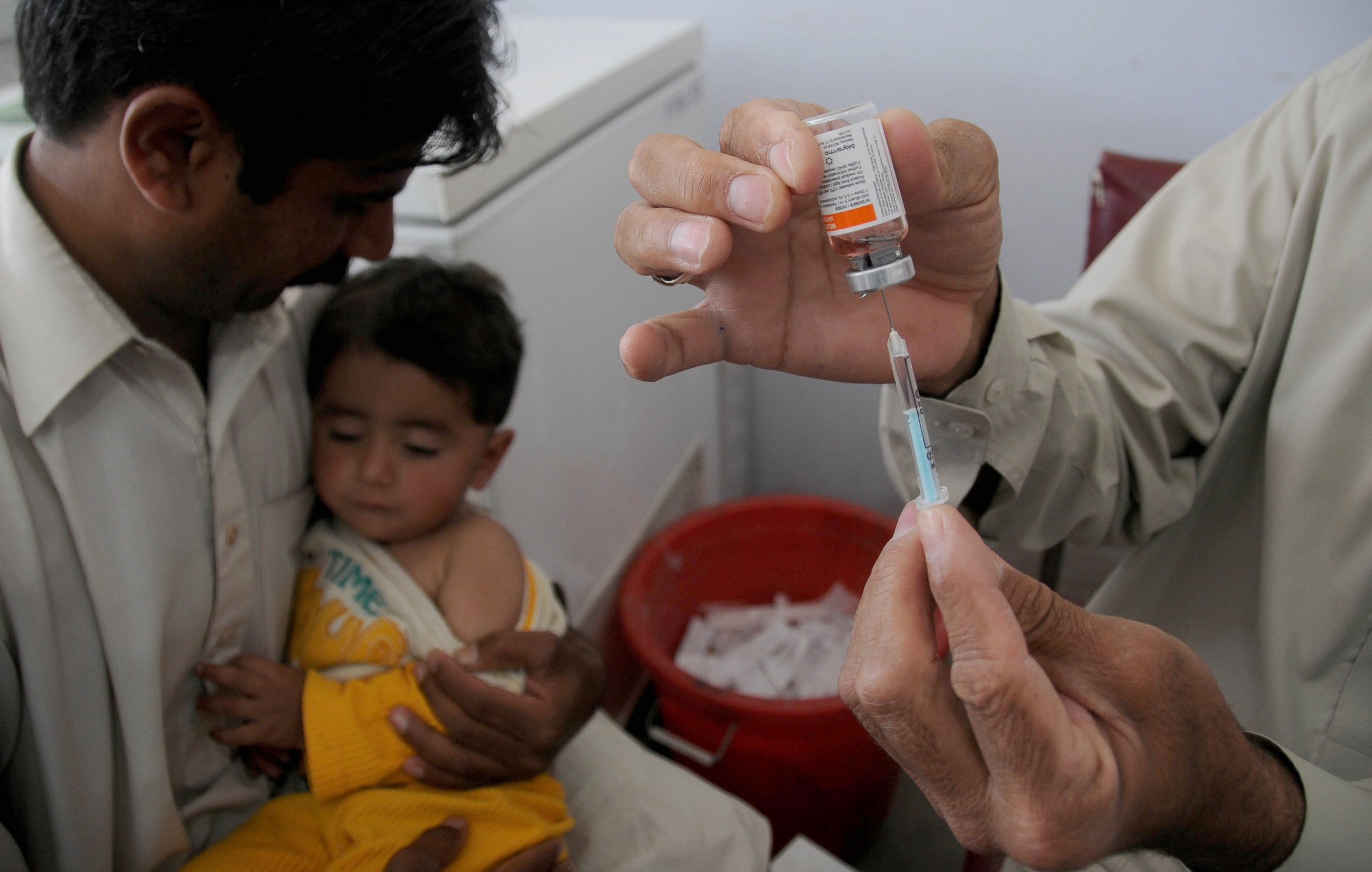 PHOTO: A Pakistani child is vaccinated during the measles campaign on the eve of World Immunization Week at a special medical centre set up at a state-run hospital, April 24, 2014, in Rawalpindi, Pakistan.