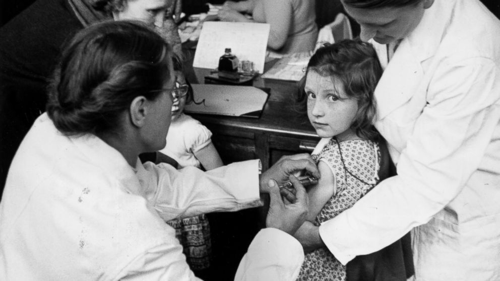 PHOTO: A child is injected with a vaccine against paralytic poliomyelitis, the first stage of the biggest vaccination programme ever undertaken in Britain, May 26, 1956.